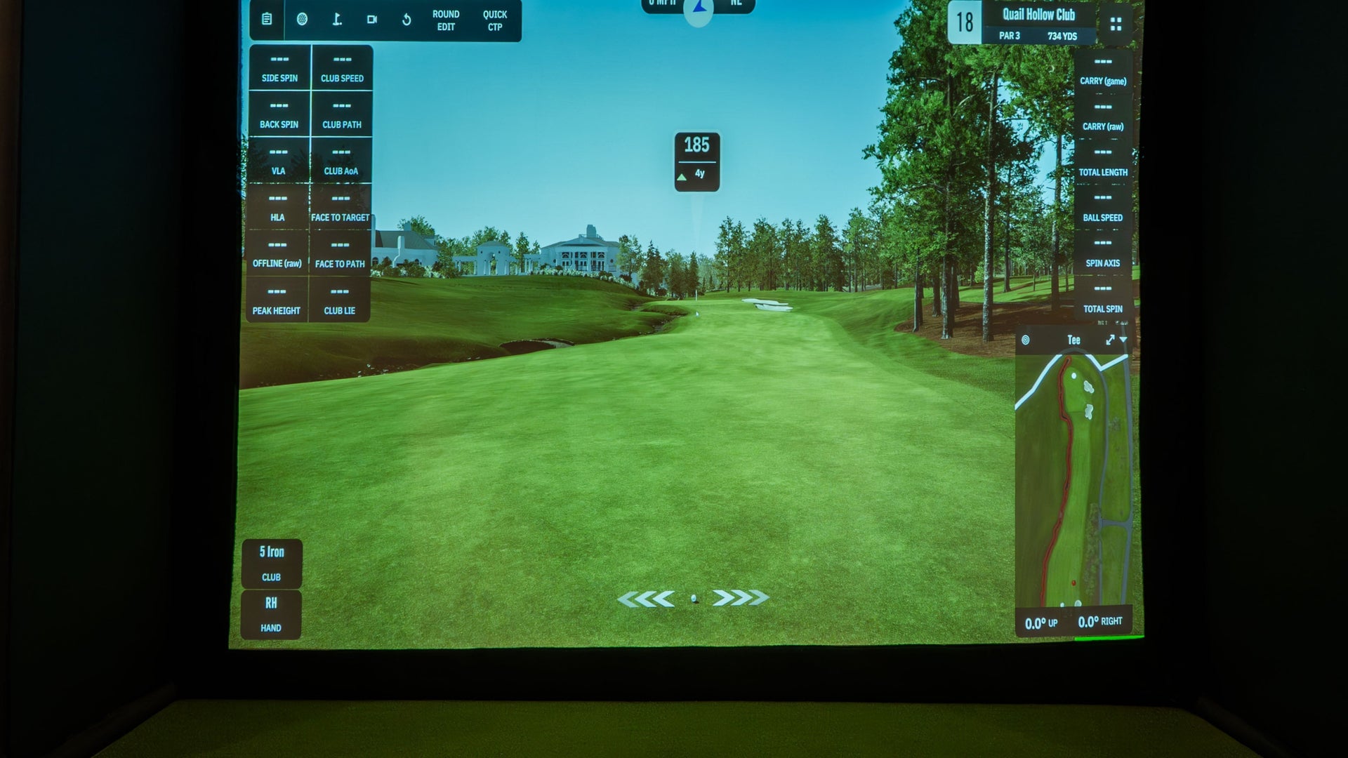 Square golf launch monitor on turf.