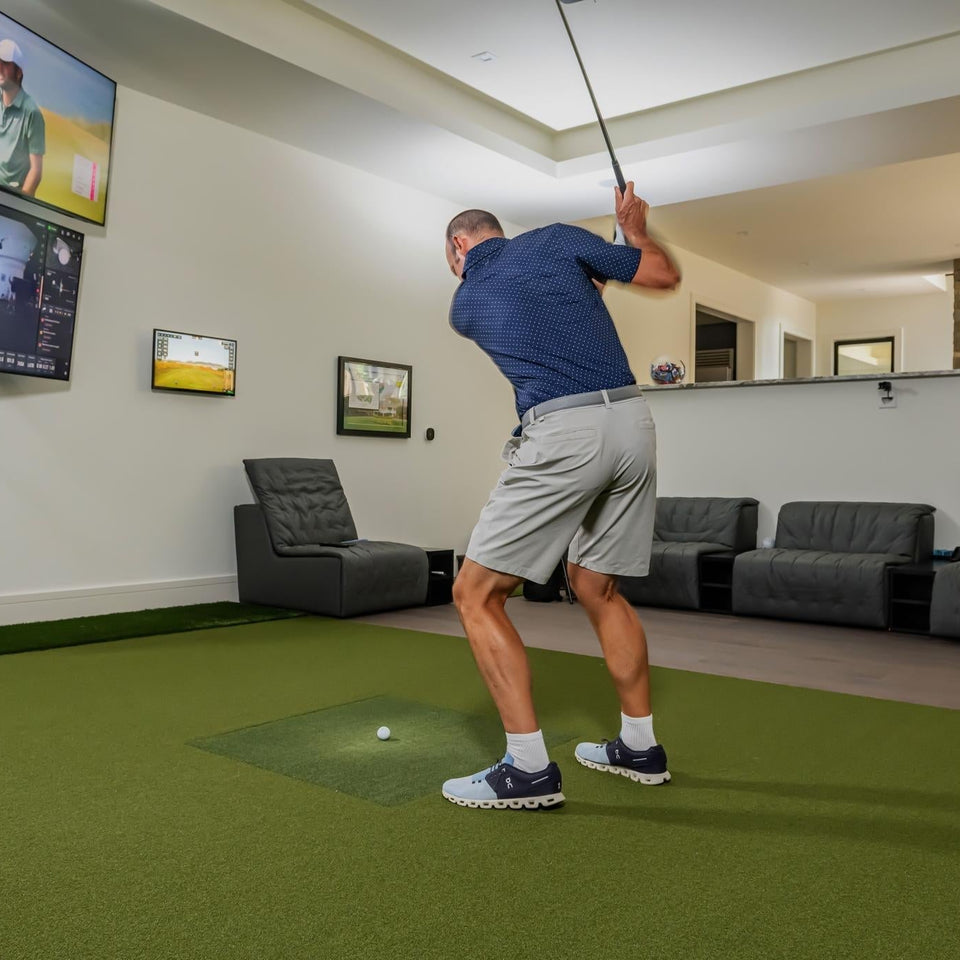 Square golf launch monitor on turf.