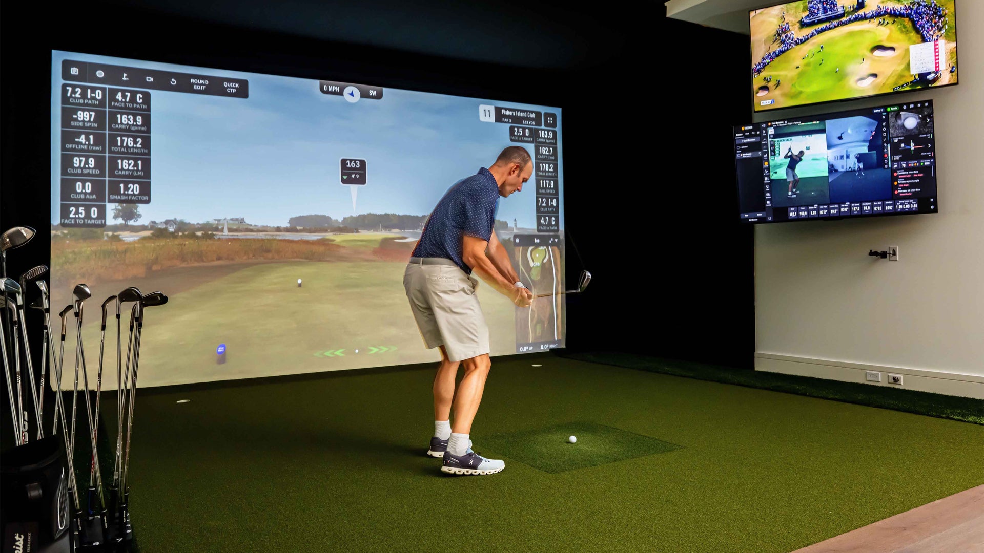 Square golf launch monitor on turf.