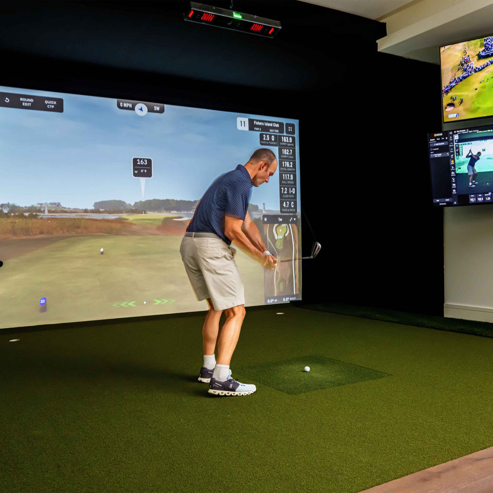 Square golf launch monitor on turf.