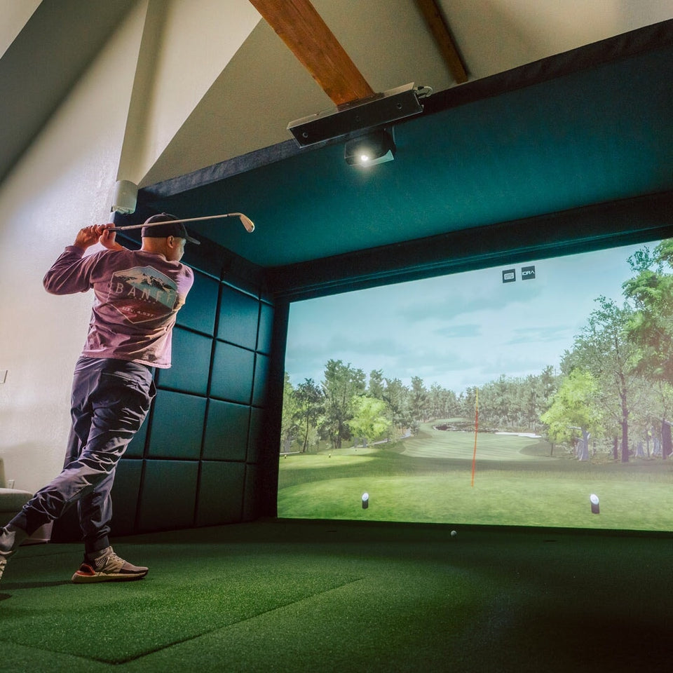 Man hitting into the SIG Golf Simulator Suite
