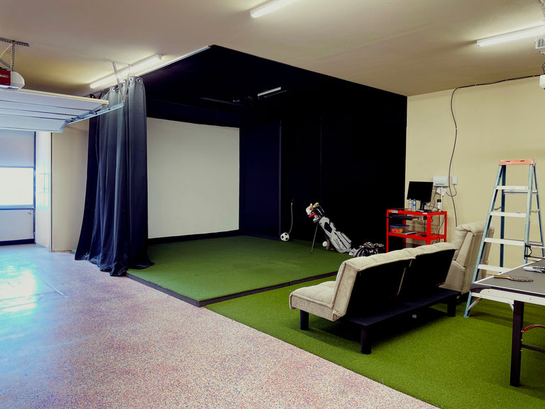 Golf simulator in a garage sig 12 with 4x10 landing mat and uneekor eye xo ceiling mount and computer. 