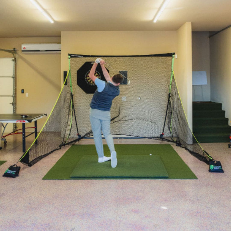 SIGPRO Golf Net indoors with golfer swinging