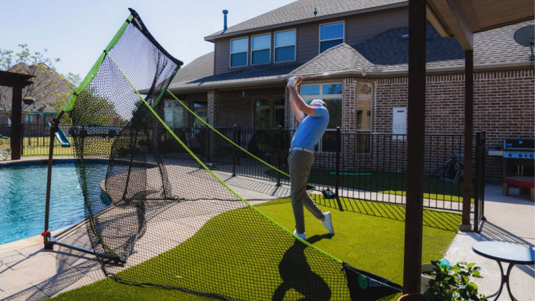SIGPRO Golf Net Outdoors with golfer swinging