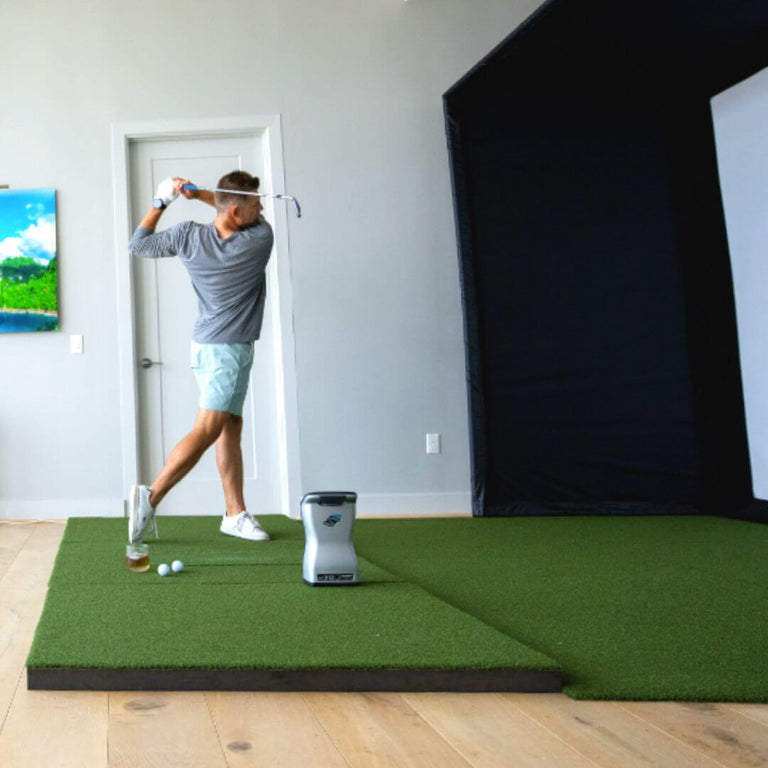 Golfer hitting on SIGPRO Softy 4' x 10' Golf Mat