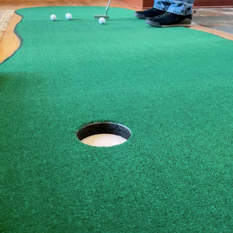 Big Moss Augusta V2 Golf Mat with golfer putting into one of the holes.