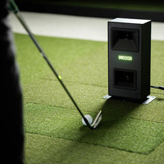 UNeekor eye mini lite golf launch monitor with golfer addressing ball