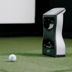 Foresight Sports GCQuad Launch Monitor with golf ball on golf mat. 