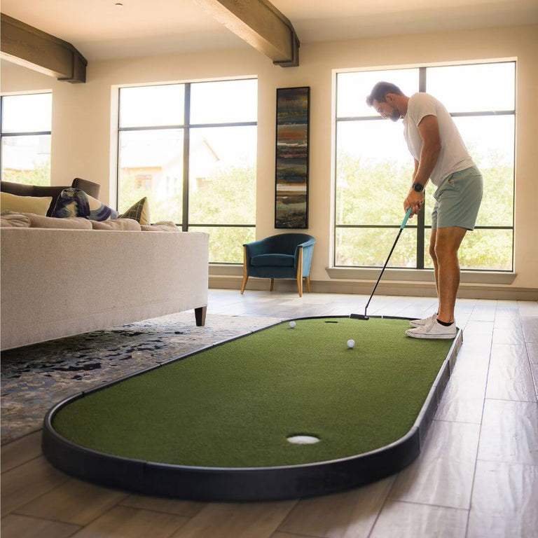 SIGPRO Tap In Putting Green with Golfer putting on green.