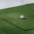SIGPRO Softy hitting strip in mat with golf ball on top. 