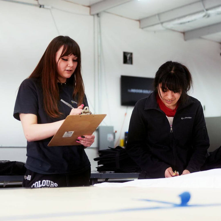 Operations team quality checking a shipment