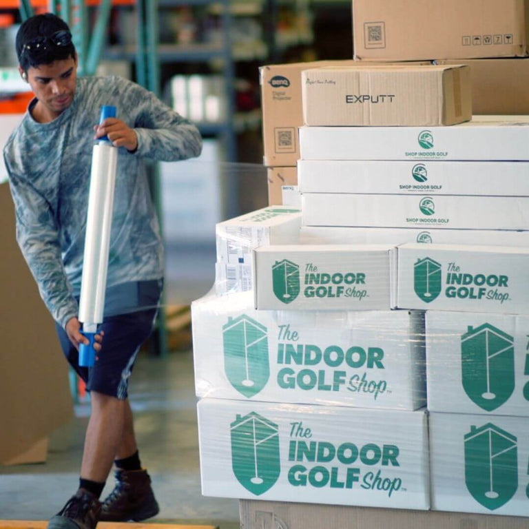 Warehouse worker packaging products